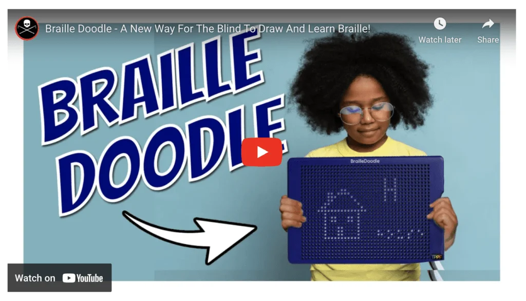 A girl with a puffy afro, a yellow is holding the BrailleDoodle